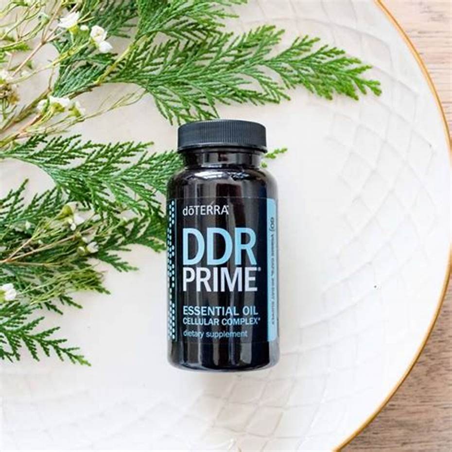 doTERRA DDR Prime supplement bottle on a white plate with greenery