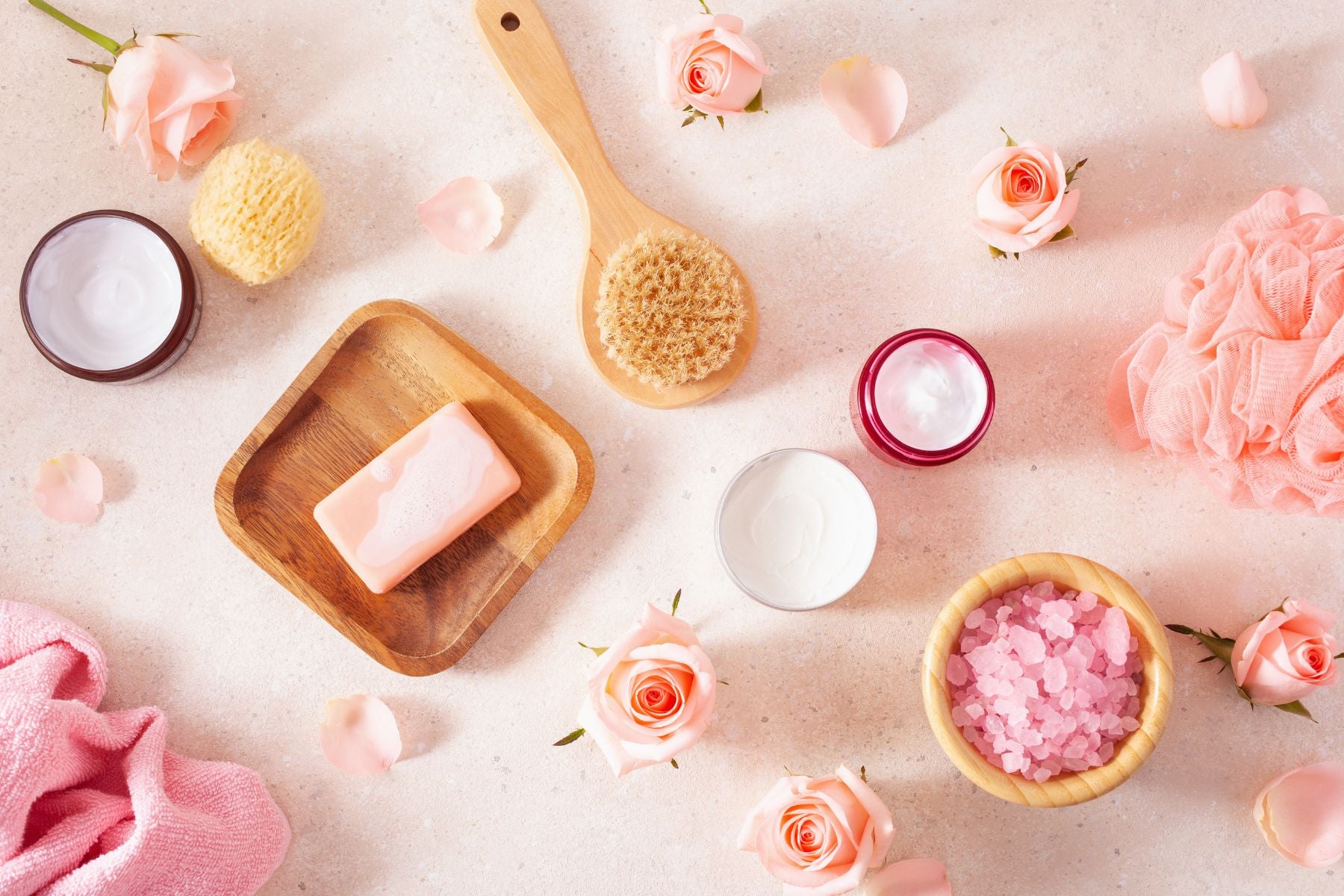 Scattered array of beauty, bath, and health items in shades of pink – Symbolizing radiant skin and beauty wellness