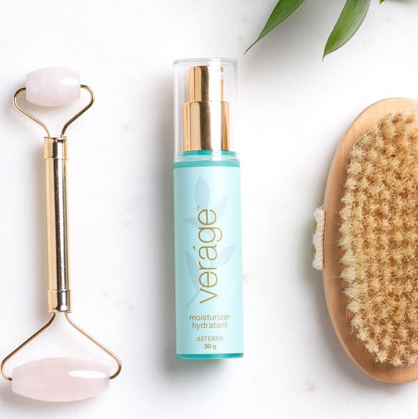 Skincare product with the label doterra verage with roller and brush on a white background