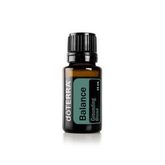 A bottle of doTERRA Balance essential oil blend with a label showing the brand and product name.