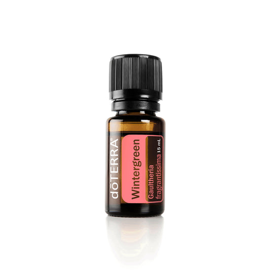 A bottle of doTERRA Wintergreen essential oil with a label and dropper cap.