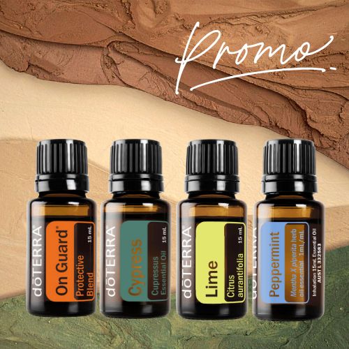 Four doTERRA essential oil bottles with labels on a textured brown and green background.