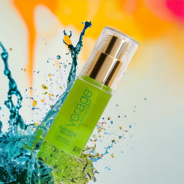 Green skincare serum bottle labeled doterra Verage with gold cap on a colourful splash background