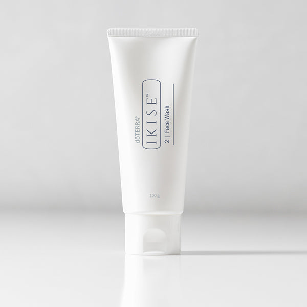 White tube of skincare product on a light gray background