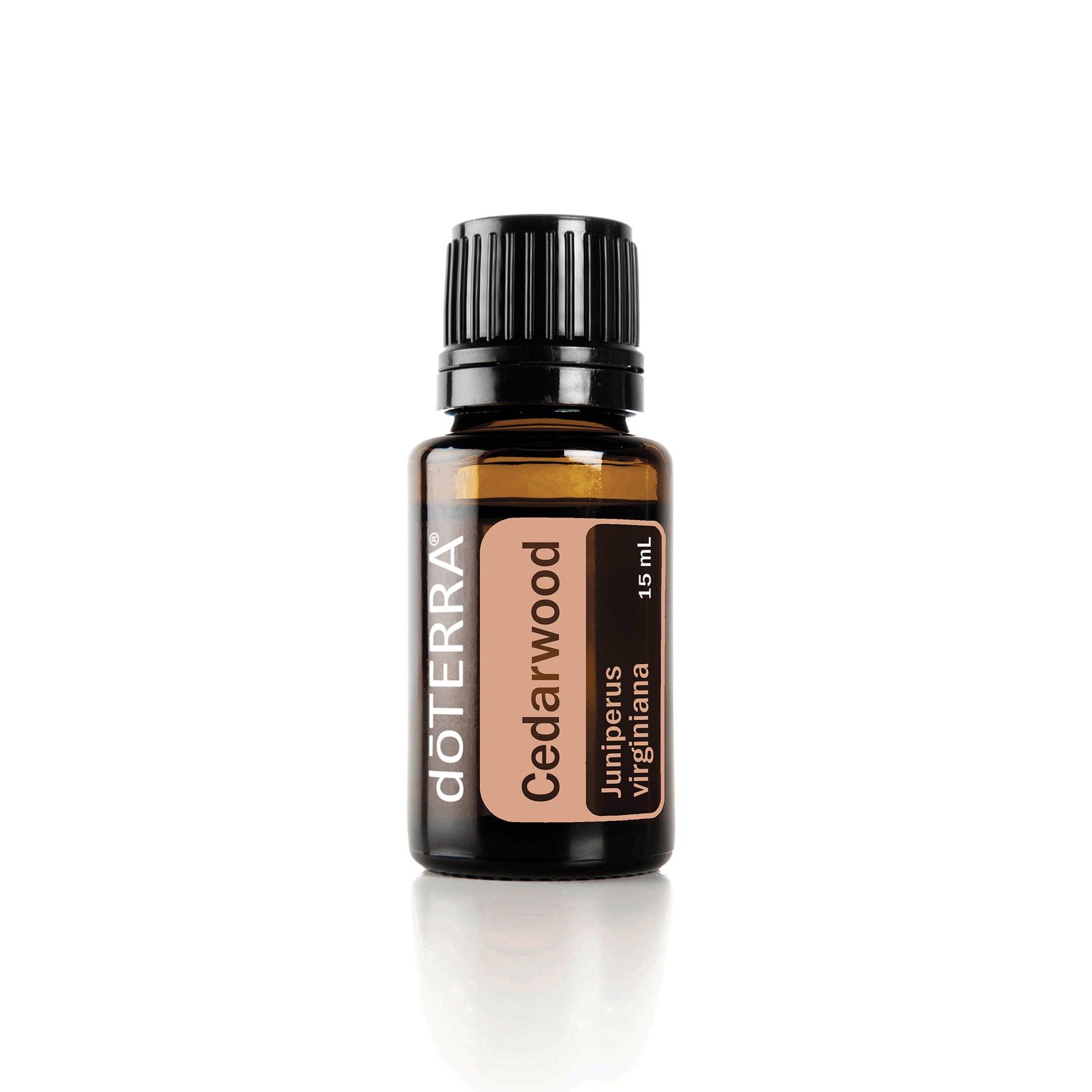 A bottle of doTERRA Cedarwood essential oil on a white background.